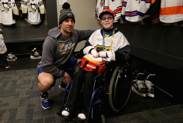 John Tavares of the New York Islanders meets with Jonathan Pitre on Jan. 30, 2016 in Nashville, Tennessee.