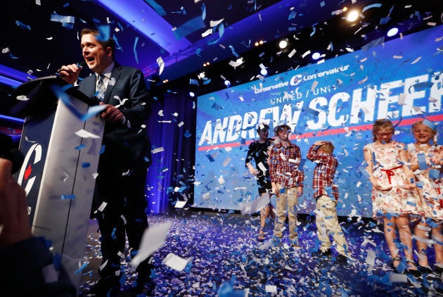 Andrew Scheer speaks as confetti falls after winning the leadership during the Conservative Party of Canada leadership convention in Toronto on May 27, 2017.