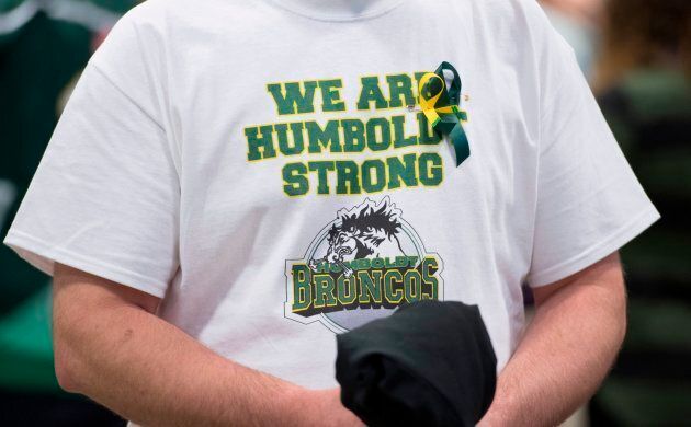 A man wears a Humboldt Broncos shirt during a vigil at the Elgar Petersen Arena, home of the Humboldt Broncos.