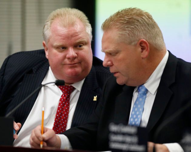 Former Toronto Mayor Rob Ford, and his brother Doug Ford, who was also a city councillor Doug Ford, are seen during a city budget meeting on Nov. 26, 2013.