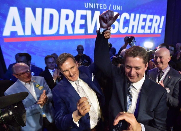 Andrew Scheer, right, is congratulated by Maxime Bernier after being elected the new leader of the federal Conservative party at the federal Conservative leadership convention in Toronto on May 27, 2017.