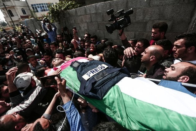 The funeral ceremony for Yaser Murtaja, a Palestinian reporter killed by the Israel Defense Forces while covering a rally on the Gaza border, is held in Gaza on April 7, 2018.