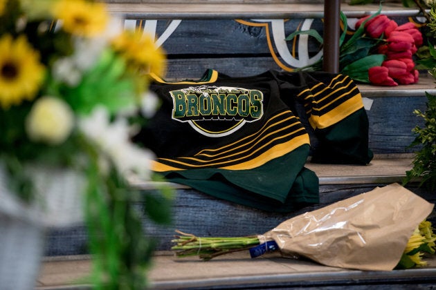 A Humboldt Broncos team jersey is seen among notes and flowers at a memorial for the Humboldt Broncos team leading into the Elgar Petersen Arena in Humboldt, Sask., on April 7, 2018.