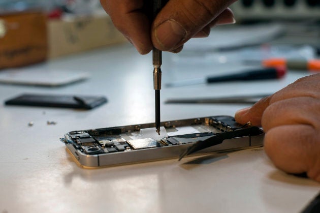 An Apple iPhone undergoing repairs.