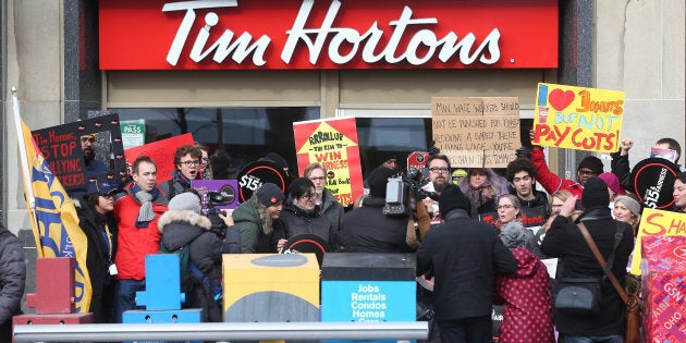 Fight for 15 and Fairness hold a rally outside the Tim Hortons location on Bloor and Bedford in Toronto on Jan. 10, 2018.