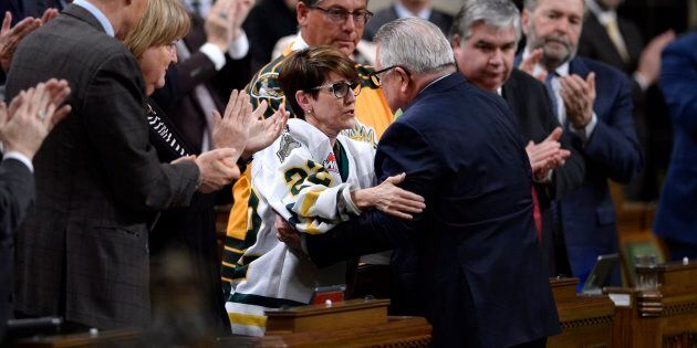 Conservative MP Kelly Block is embraced by Public Safety Minister Ralph Goodale after her statement on the Humboldt Broncos tragedy in the House of Commons on April 17, 2018.