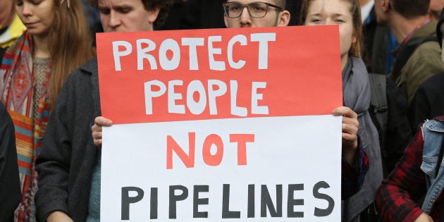 Protesters hold a rally at City Hall before a march against the proposed expansion of Kinder Morgan's Trans Mountain Pipeline in Vancouver, British Columbia, Canada November 19, 2016. REUTERS/Chris Helgren