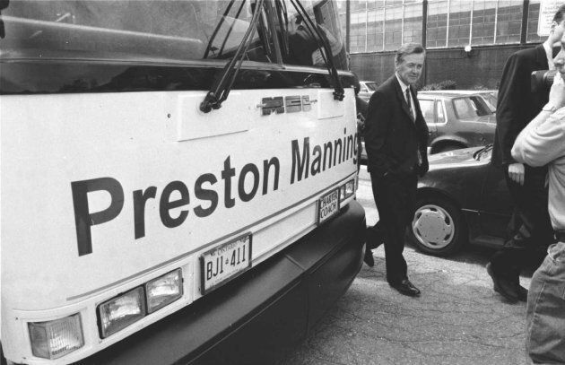 Preston Manning walks by his bus at the Global Television studios on May 23, 1997.