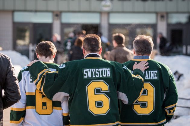 Community members arrive at the Elgar Petersen Arena for a vigil for the Humboldt Broncos in Humboldt, Sask., on April 8, 2018.