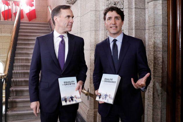 Prime Minister Justin Trudeau, right, helps deliver Budget 2018 on Parliament Hill in Ottawa on Feb. 27, 2018.