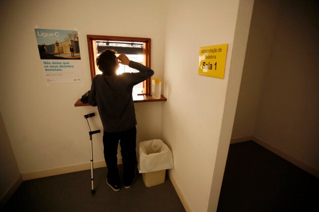 A patient drinks his doses of methadone at a rehabilitation clinic in Lisbon on Aug. 10, 2012. It's one of dozens of clinics across the country, the result of Portugal's pioneering drugs policy.