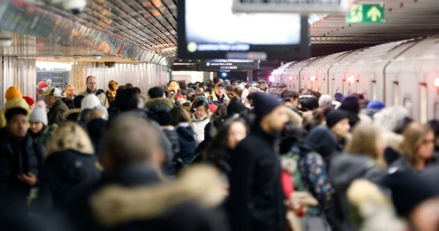 A crowded Toronto Transit Commission subway platform at Bloor-Yonge Station.