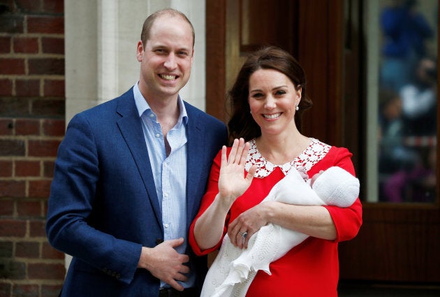 The royal couple waves to onlookers.