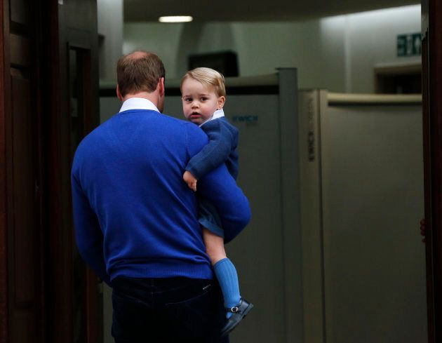 Britain's Prince William returns with his son George to the Lindo Wing of St Mary's Hospital, after the birth of his daughter in London, Britain May 2, 2015.