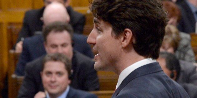 Prime Minister Justin Trudeau responds to a question in the House of Commons on June 5, 2017 as Conservative Leader Andrew Scheer looks on.