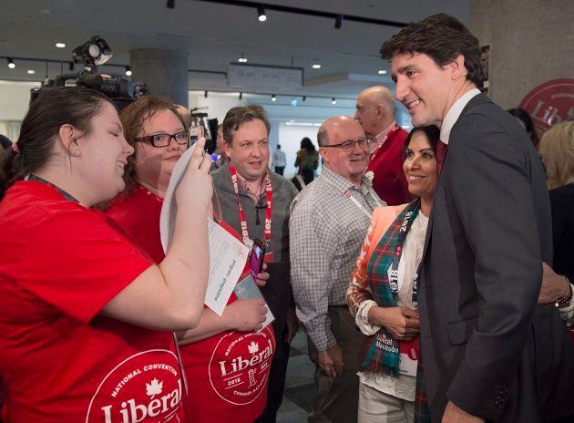The prime minister poses for photos as he arrives at the federal Liberal national convention in Halifax on April 20, 2018.