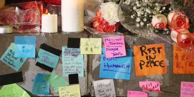 Messages on post-it notes sit in the rain April 24, 2018. A candlelight vigil is held at Olive Square near Yonge and Finch Streets for the 10 people that were killed and the 15 injured in the van attack along Yonge Street between Sheppard and Finch streets in Toronto.