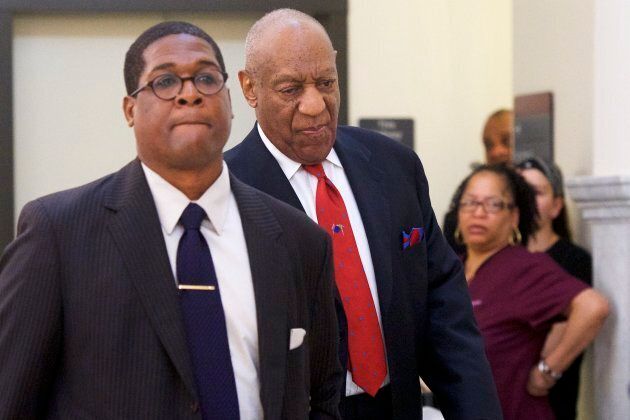 Bill Cosby, centre, walks through the Montgomery County Courthouse with his publicist, Andrew Wyatt, after being found guilty on all counts in his sexual assault retrial on April 26, 2018 in Norristown, Pennsylvania.