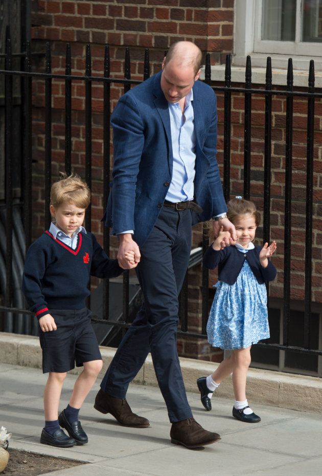 Prince William arrives with Prince George and Princess Charlotte at the Lindo Wing after Catherine gives birth.