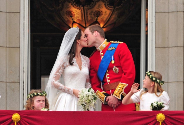 The Duke and Duchess of Cambridge kiss on the balcony of Buckingham Palace on April 29, 2011.