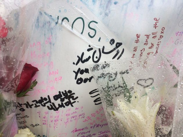 Messages written on a poster at a memorial in Toronto.