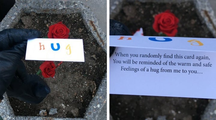 Nadine Weis and her four children, ages 18 months to 11 years, handed out these cards to 'whoever needed one,' at a vigil for the victims of a van attack in Toronto on April 29, 2018.