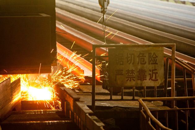 Steel H-beams are cut at the China Oriental Group Co. steel plant in Tangshan, Hebei province, China.