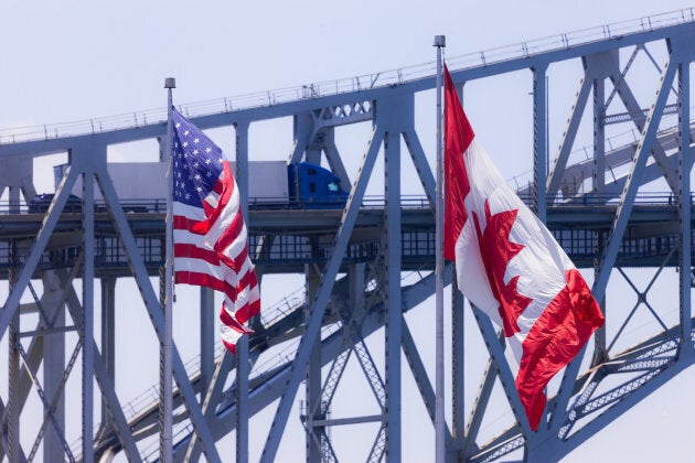 Vehicles make their way across the Blue Water Bridge in Sarnia, Canada, on June 11, 2017.