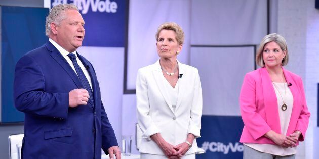 Liberal Premier Kathleen Wynne, centre, Progressive Conservative Leader Doug Ford, left, and NDP Leader Andrea Horwath take part in the Ontario Leaders debate in Toronto on May 7, 2018.