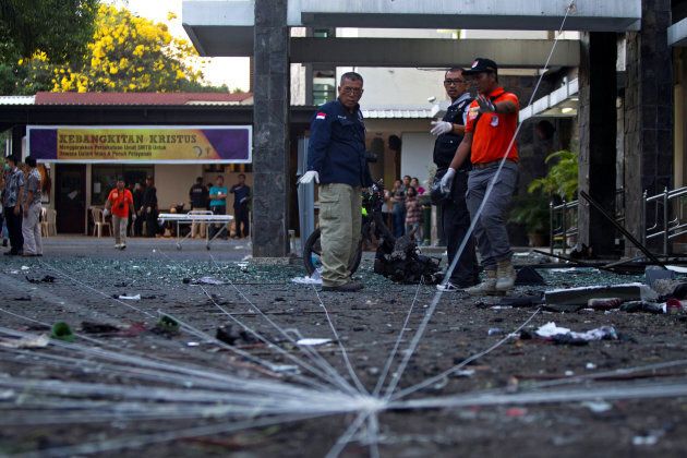 Police forensic team examine the scene of a bomb at a church in Surabaya, East Java, Indonesia on May 13, 2018.