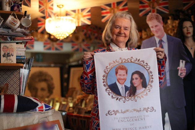 Margaret Tyler holds memorabilia celebrating the upcoming wedding of Prince Harry to Meghan Markle, in her home in north London.