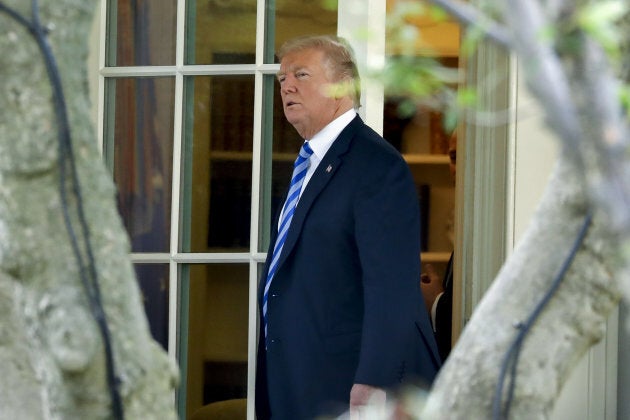 U.S. President Donald Trump walks out of the Oval Office of the White House.