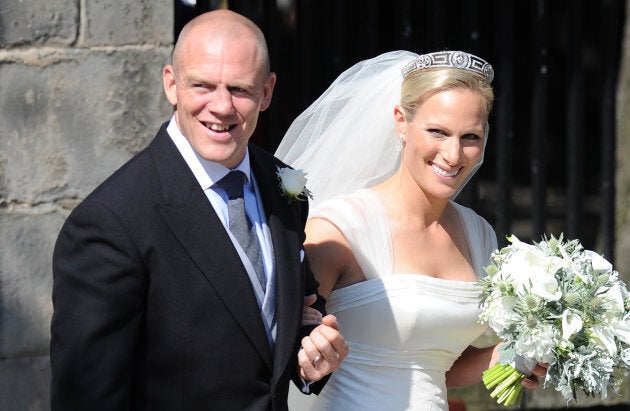 Mike Tindall and Zara Phillips emerge from Canongate Kirk in Edinburgh after their wedding.