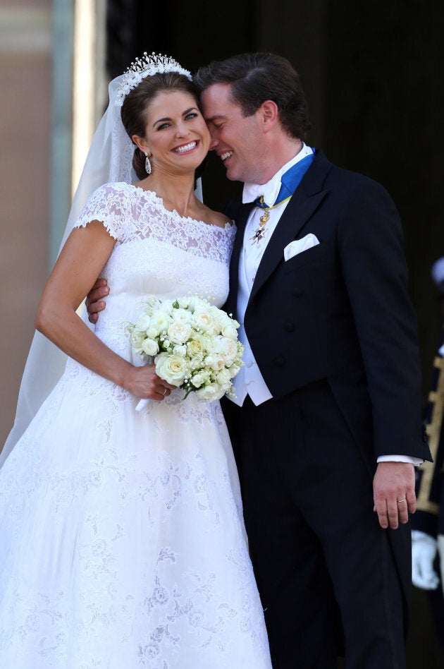 Princess Madeleine of Sweden and Christopher O'Neill smile at well wishers following their marriage ceremony in the in the Royal Chapel inside the Royal Palace in Stockholm, Sweden.