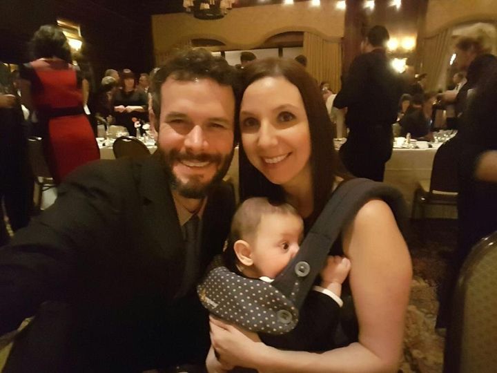 The author, her husband, and their son in one of the rare moments all three were in a room at the same time during a 2017 wedding.