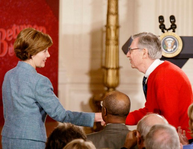 Then First Lady Laura Bush greets "Mister Rogers" in the East Room of the White House on April 3, 2002.