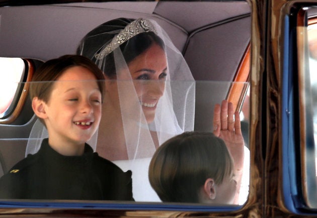 Page boys John and Brian Mulroney with Meghan Markle as she arrives in a car for her wedding to Prince Harry on Saturday.