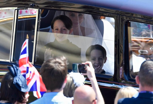 Page boys John and Brian Mulroney accompany Markle as she arrives for the ceremony.