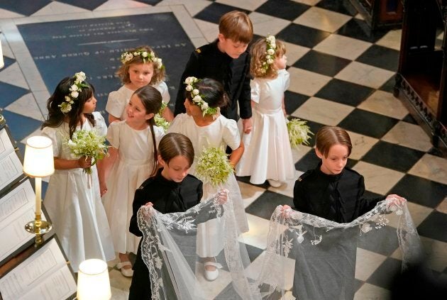 Bridesmaids and page boys, including John and Brian Mulroney, walk behind Meghan Markle during her wedding to Britain's Prince Harry, Duke of Sussex, in St George's Chapel, Windsor Castle, in Windsor, on Saturday.