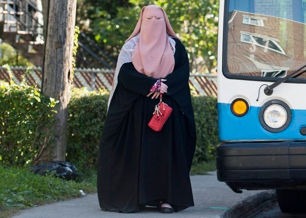 Warda Naili wears a Burka on a street in Montreal, Oct. 21, 2017.