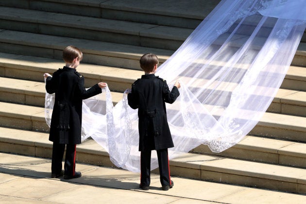 Page boys John and Brian Mulroney accompany Meghan Markle as she arrives in a car for the wedding ceremony to marry Britain's Prince Harry, Duke of Sussex, at St George's Chapel, Windsor Castle, in Windsor, on May 19, 2018.