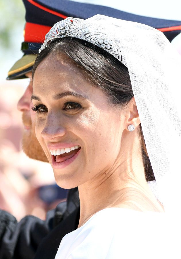 Meghan, Duchess of Sussex leaves Windsor Castle in the Ascot Landau carriage during a procession after getting married at St Georges Chapel on May 19, 2018 in Windsor, England.