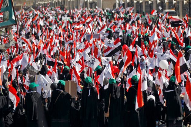 Yemenis attend a rally marking the third anniversary of the Saudi-led coalition's intervention in Yemen, in the capital Sanaa, on March 26, 2018.