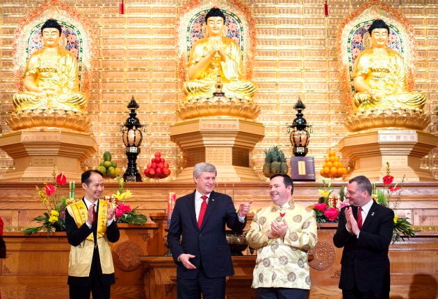 Stephen Harper takes part in the 2015 Chinese New Year Festival with Jason Kenney at the Fo Guang Shan Temple of Toronto in Mississauga, Ont. on Feb. 20, 2015.