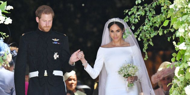Prince Harry and Meghan Markle walk down the steps of St George's Chapel in Windsor Castle after their wedding.
