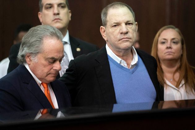 Film producer Harvey Weinstein stands with his lawyer Benjamin Brafman (L) inside Manhattan Criminal Court during his arraignment in Manhattan, May 25, 2018.