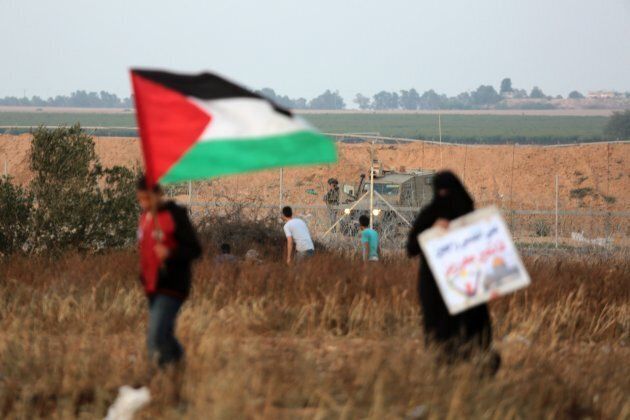 Israeli occupation forces intervene during a Parelstinian protest, organized to mark 70th anniversary of Nakba, also known as Day of the Catastrophe in 1948, and against the United States' plans to relocate the U.S. Embassy from Tel Aviv to Jerusalem, near Israel border in Khan Yunis, Gaza on May 16, 2018.