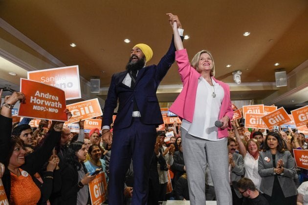 Federal NDP leader Jagmeet Singh welcomes provincial NDP leader Andrea Horwath to the stage at an NDP rally in Brampton, Ontario on May 21, 2018.