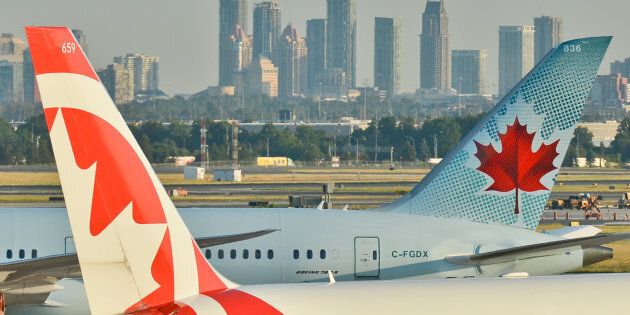Air Canada planes at Toronto's Pearson International Airport, Wed. July 20, 2016. Airfares in many Canadian cities have dropped sharply, according to data compiled by airfares site Kayak.com.