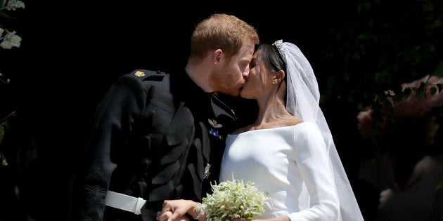 Prince Harry and Meghan Markle kiss outside St George's Chapel in Windsor Castle after their wedding on May 19, 2018.